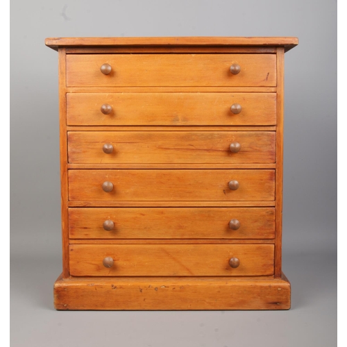 80 - Entomology, a pine specimen chest with six drawers of pinned butterflies under glass. Bearing Natura... 