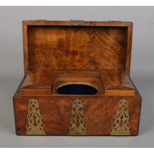 88 - A Victorian burr walnut tea caddy with brass mounts.