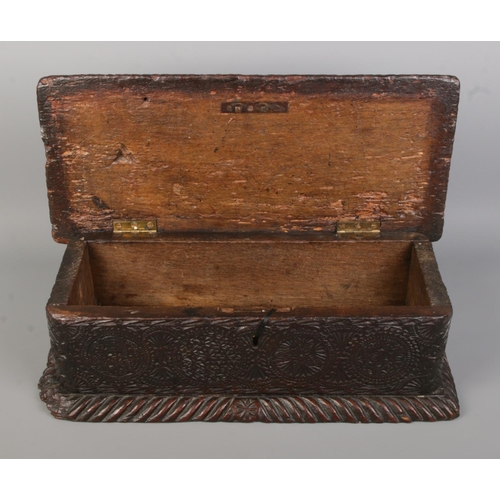 89 - A period carved oak box. Height 15cm, length 48cm, depth 22cm.