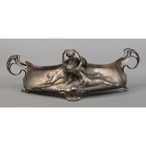 93 - A WMF silver plated centrepiece/planter. Decorated in relief with an embracing couple. Stamped WMF O... 