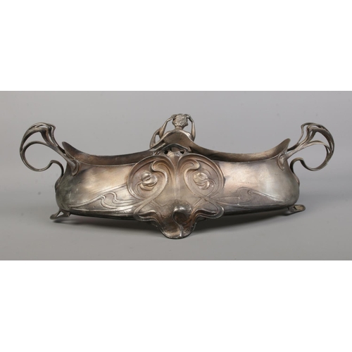 93 - A WMF silver plated centrepiece/planter. Decorated in relief with an embracing couple. Stamped WMF O... 