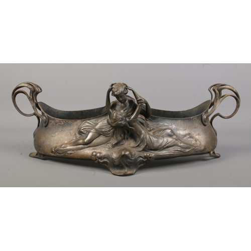 94 - A WMF silver plated centrepiece/planter. Decorated in relief with an embracing couple. Stamped WMF A... 