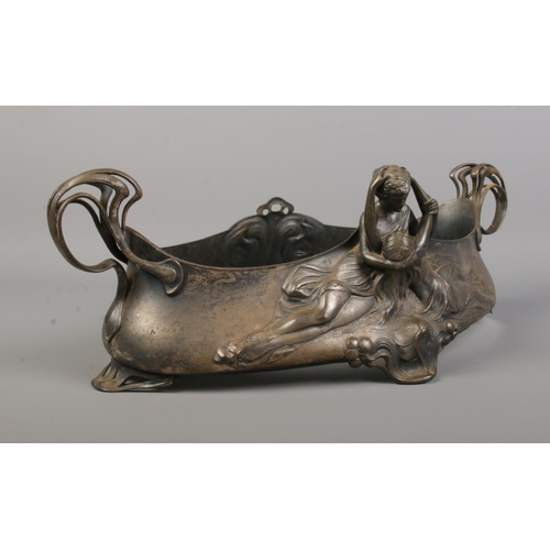 94 - A WMF silver plated centrepiece/planter. Decorated in relief with an embracing couple. Stamped WMF A... 