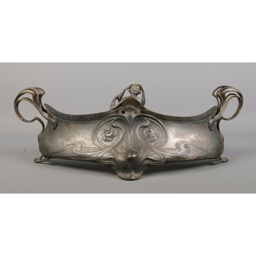 94 - A WMF silver plated centrepiece/planter. Decorated in relief with an embracing couple. Stamped WMF A... 