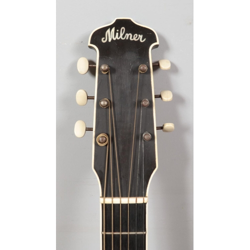 99 - A vintage Milner acoustic guitar. Having black body, white trim and mother of pearl inlay to fret bo... 