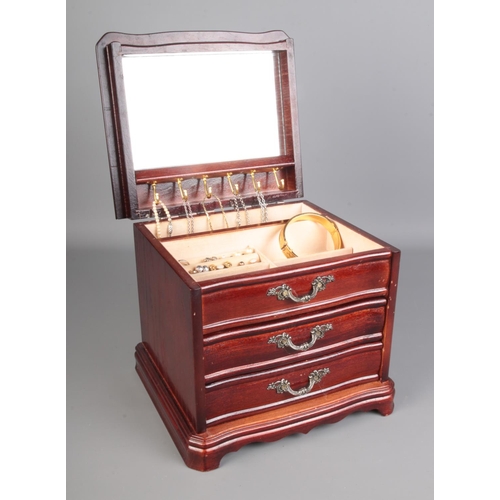 502 - A wooden jewellery box containing a large amount of costume jewellery including some silver, rings, ... 