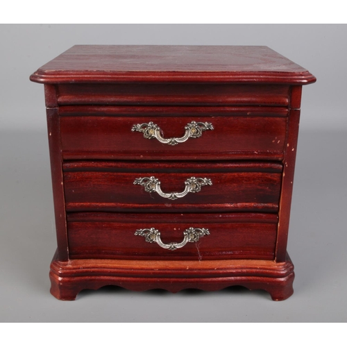 502 - A wooden jewellery box containing a large amount of costume jewellery including some silver, rings, ... 