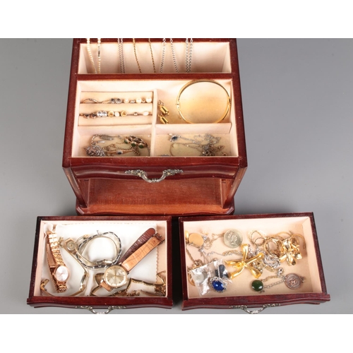 502 - A wooden jewellery box containing a large amount of costume jewellery including some silver, rings, ... 