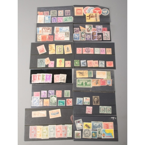 505 - A collection of vintage and antique world stamps. Includes Canadian War Tax one cent, Nouvelles Hebr... 