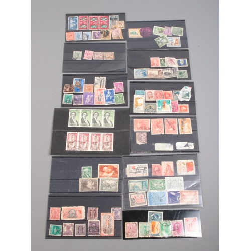 505 - A collection of vintage and antique world stamps. Includes Canadian War Tax one cent, Nouvelles Hebr... 