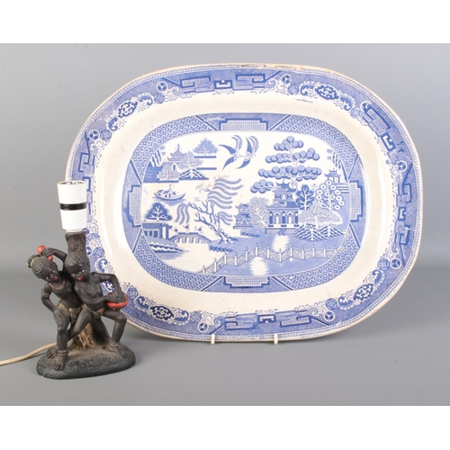 508 - An antique blue and white meat plate bearing the 'Old Willow' pattern, together with a composite tab... 