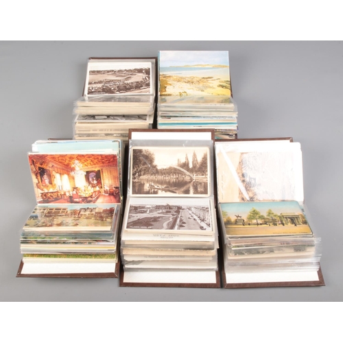 509 - Five small albums of vintage postcards contained in several albums, including examples of English to... 