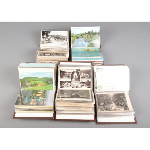 509 - Five small albums of vintage postcards contained in several albums, including examples of English to... 