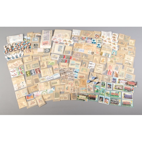 512 - A large collection of loose stamps. Mainly British commemorative examples, includes St Vincent Mexic... 