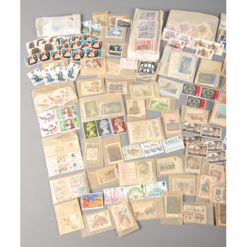 512 - A large collection of loose stamps. Mainly British commemorative examples, includes St Vincent Mexic... 