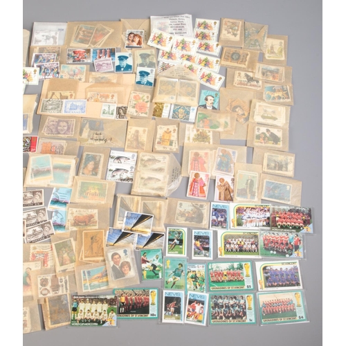 512 - A large collection of loose stamps. Mainly British commemorative examples, includes St Vincent Mexic... 