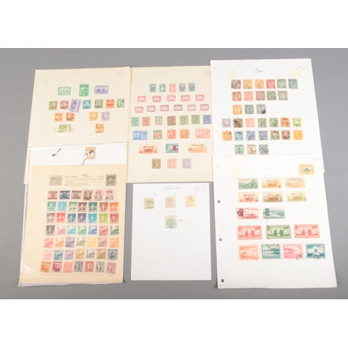 520 - A collection of Chinese stamps. Includes One Candarin green dragon stamp.