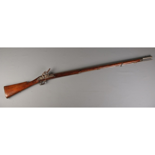 527 - A 19th century flintlock rifle with brass mounts and cleaning rod. Total length 161cm. CAN NOT POST.