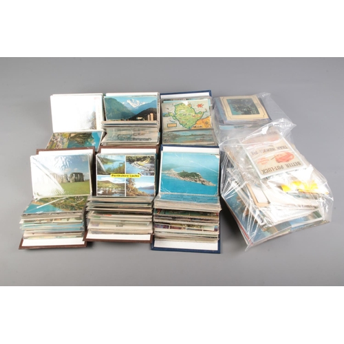 529 - Six small albums of vintage postcards contained in several albums, including examples of English tow... 