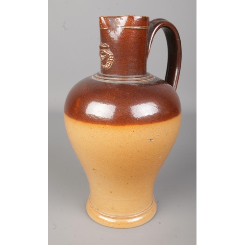 533 - A Doulton Lambeth salt glazed stoneware jug. Approx. height 24cm.