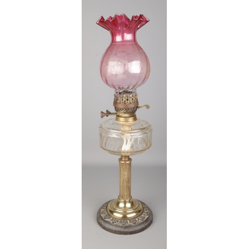 535 - A early Twentieth Century 'British Made' oil lamp, featuring cylindrical Corinthian column, glass re... 