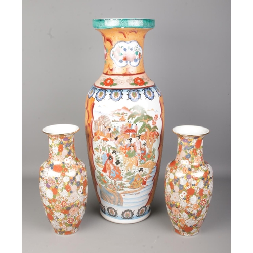 537 - A collection of oriental ceramic vases to include large example featuring riverside village scene. H... 