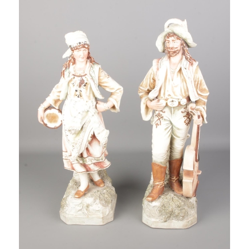 540 - A pair of Royal Dux style ceramic figural vases formed as travelling musicians, both stamped JM6523 ... 