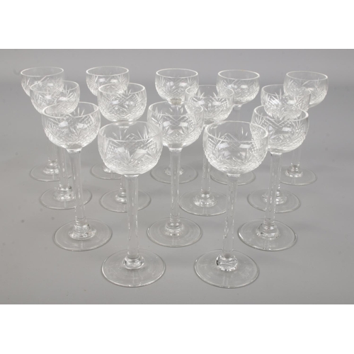 542 - A set of 14 cut glass long stem sherry/port glass