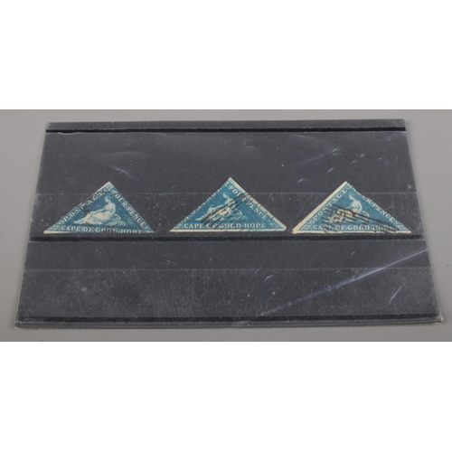 549 - Three 19th century Cape of Good Hope Four Pence triangle stamps.