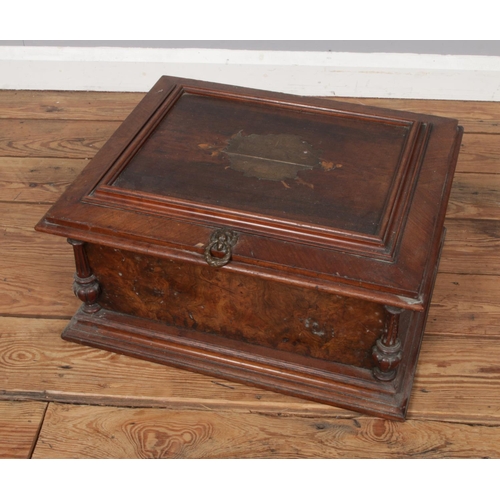 556 - A 19th century table Symphonion walnut case featuring brass mounts and floral inlaid top.