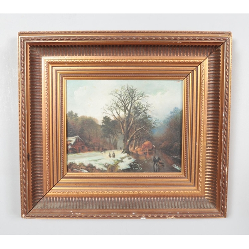 563 - A gilt framed continental oil on board depicting a snowy landscape by a frozen river, unsigned. Appr... 