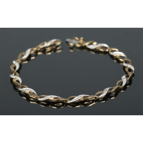 591 - A 9ct gold bracelet set with 12 small diamonds

5.67g