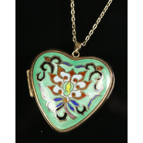 609 - A heart shaped enamel and silver gilt locket on chain