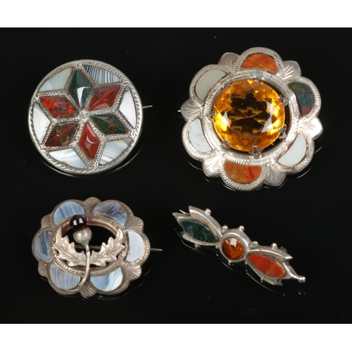 617 - A collection of four Scottish silver brooches