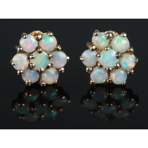 643 - A pair of 9ct gold opal cluster stud earrings.