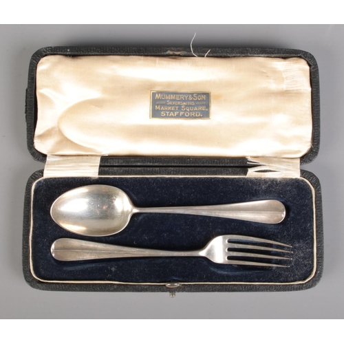 672 - A cased James Dixon & Sons silver spoon and fork, hallmarked for Sheffield 1918. Approx. weight 61.4... 