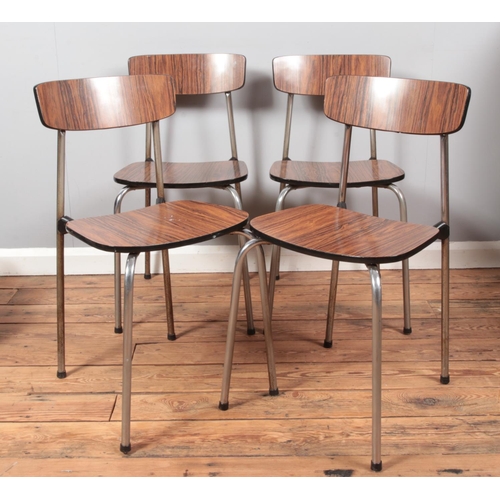 679 - A set of four retro Formica and chromed frame kitchen/dining chairs, with curved backrest and wood e... 