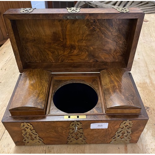 88 - A Victorian burr walnut tea caddy with brass mounts.