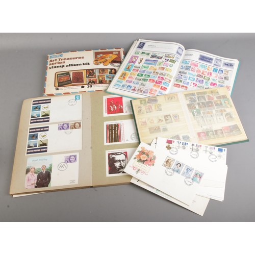 56 - A quantity of stamp albums including stamps from around the world together with a Hornby art treasur... 