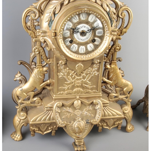 1 - A French brass clock garniture. Height 62cm.