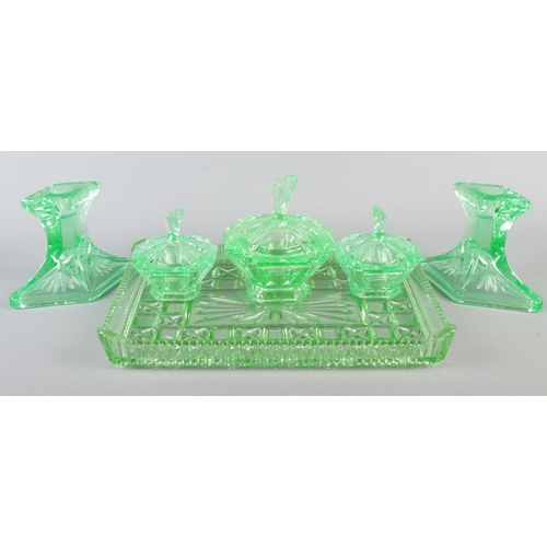 10 - A vivid green uranium glass dressing table set, six pieces