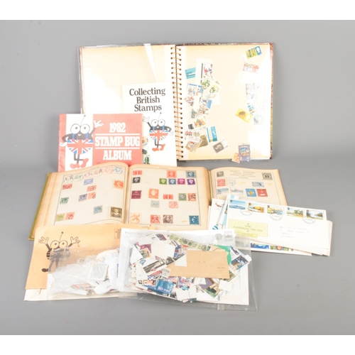 103 - A box of British and world stamps, loose and in albums. Includes Souvenir/First Day Covers.