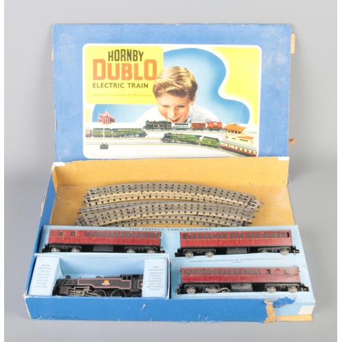 105 - A Hornby 00 Gauge Suburban Passenger Train model railway set to include locomotive and track.