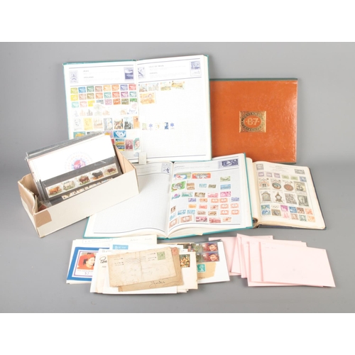 108 - A large collection of stamps from around the world including some first day covers