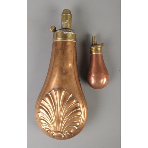 113 - An 19th century copper powder flask along with a small example. The smaller example stamped JD&S (Ja... 