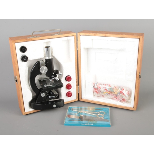 118 - A cased students Lunax microscope.