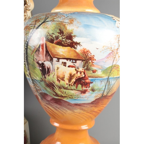 12 - A trio of large Victorian porcelain vases with hand painted and gilt finish 

Largest Hx63cm