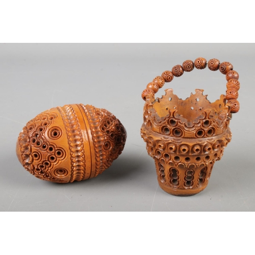 120 - Two Coquilla nut carvings including a basket and a vinaigrette in the shape of an egg circa 1890