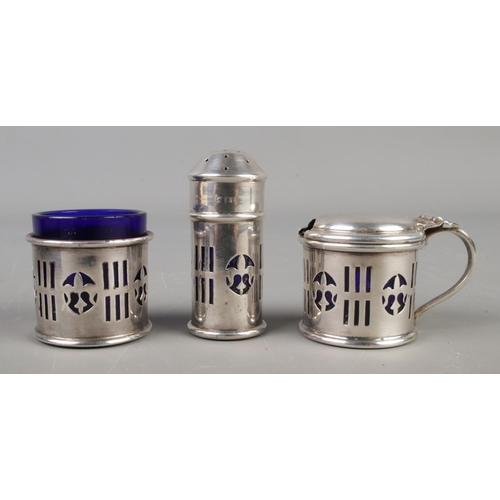 135 - A three piece silver cruet set with blue glass liners in its original box, assayed Birmingham 1922

... 