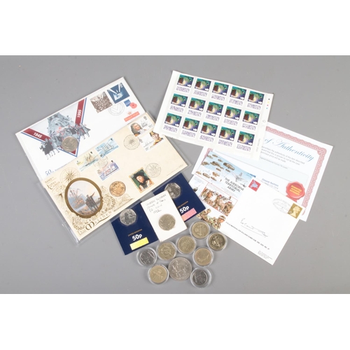 137 - A quantity of assorted commemorative coins, first day covers and stamps. To include fifteen 1st clas... 